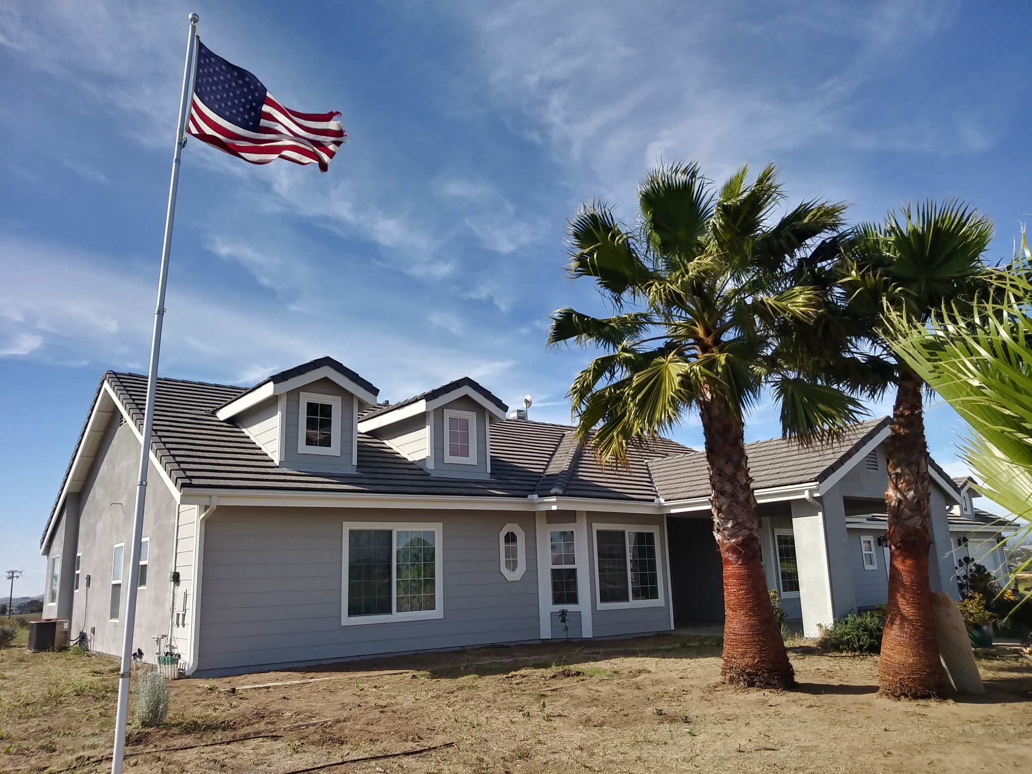 Completed exterior paint job on large two-story home